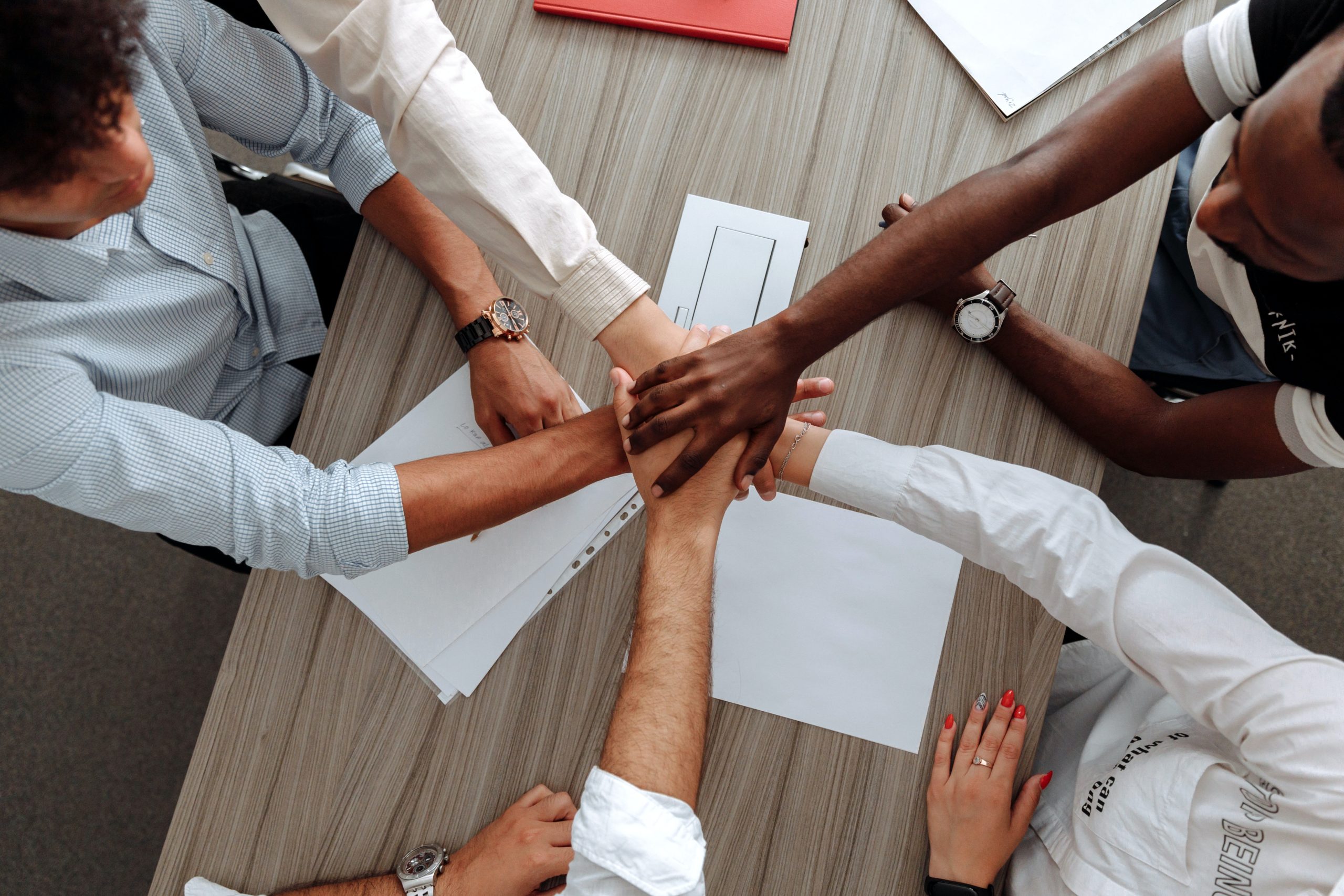 a team of five people at an office 